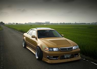 Gold Toyota Mark II on Road