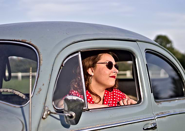 Woman in Vintage Car with Sunglasses