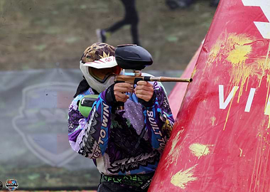 Paintball Player Aiming from Behind Cover
