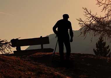 Silhouette of an elderly man with cane