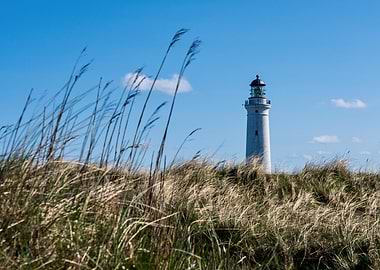 Lighthouse on a grassy hill