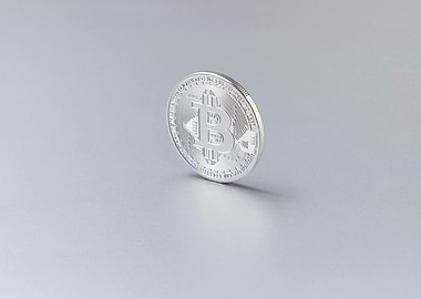 Silver Bitcoin Coin on Gray Background