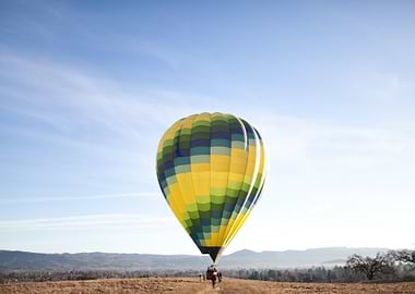 Hot Air Balloon Launching in Field