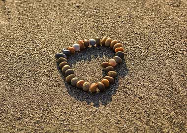 Pebble Bracelet on Sandy Beach
