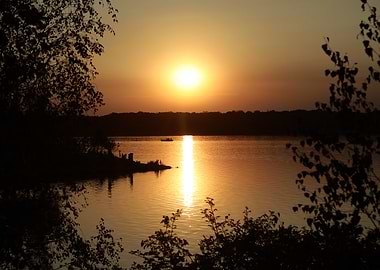 Golden Sunset Over Lake with Silhouettes