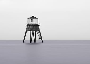 Black and White Lighthouse in the Sea