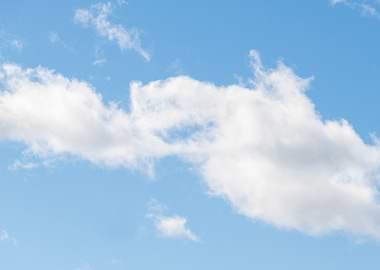 Blue sky with fluffy white clouds