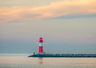 Red and White Lighthouse at Sunset