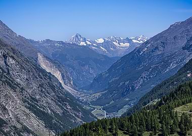 Mountain Valley Landscape with Snow-Capped Peaks