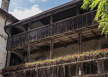 Old Wooden Balcony with Flowers