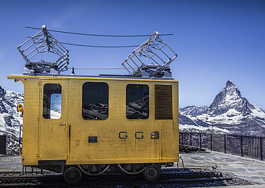 Golden Train with Mountain Backdrop