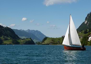 Sailboat on Lake with Mountain Backdrop