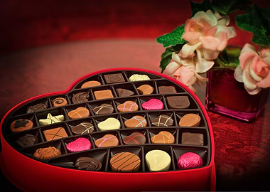 Heart-shaped chocolate box with flowers