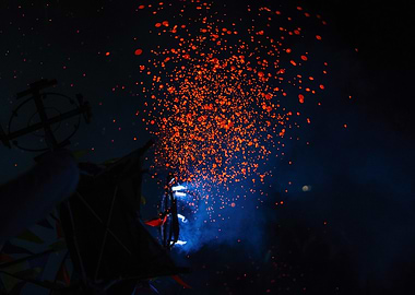 Orange Sparks in the Dark Night