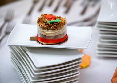 Elegant Dessert on Stacked White Plates