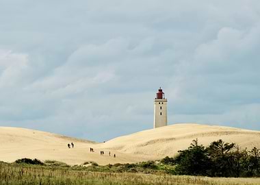 Lighthouse on Sand Dunes with People