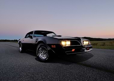 Black Pontiac Trans Am at Dusk
