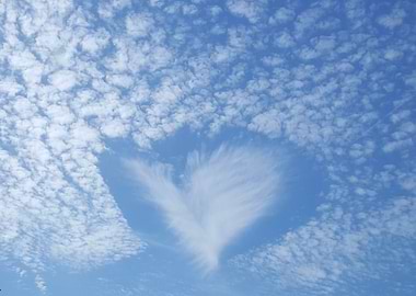Heart-shaped cloud in a blue sky