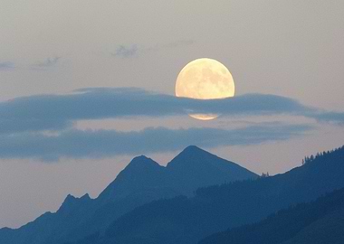 Full Moon Over Mountain Peaks