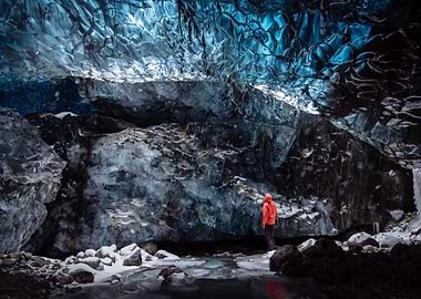 Ice Cave Exploration with Person in Orange