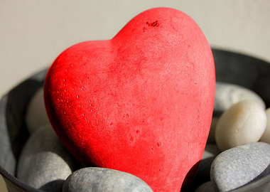 Red Heart Stone on Pebbles