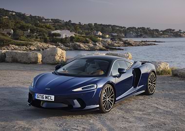 Blue McLaren GT on Coastal Road