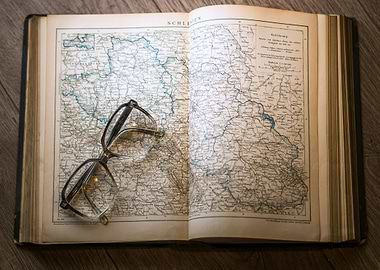 Open Map Book with Glasses