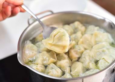 Boiling dumplings in a pot