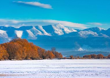 Snowy Mountains and Frozen Lake