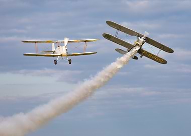 Two Biplanes Performing Aerobatics with Smoke