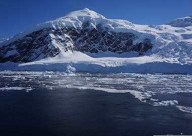 Antarctic Landscape with Icebergs and Mountain