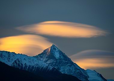 Snowy Mountain Peak with Lenticular Clouds