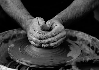 Potter's Hands Shaping Clay on Wheel