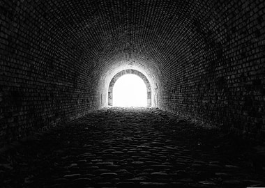 Monochrome Brick Tunnel with Bright Light