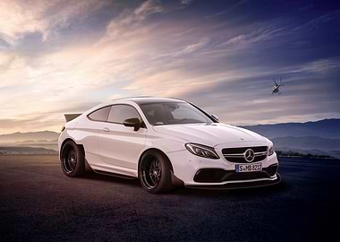 White Mercedes-Benz Coupe with Helicopter Backdrop