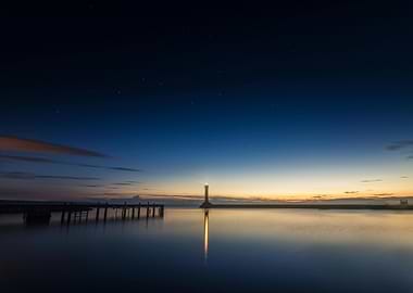 Lighthouse at Night with Starry Sky