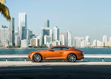 Orange Bentley with Miami Skyline