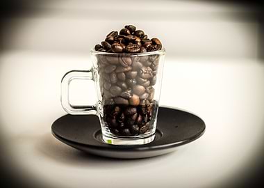 Coffee beans in a glass cup
