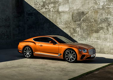 Orange Bentley Continental parked outdoors