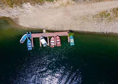 Boats Docked on a Lake Pier