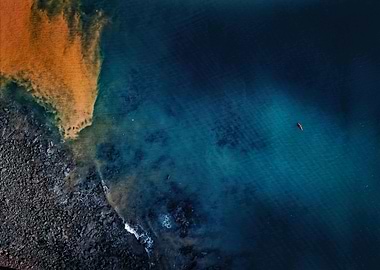 Aerial view of kayak in blue water