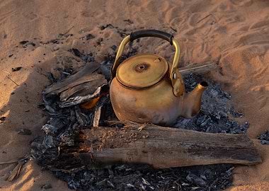 Teapot on Embers in Desert Sand