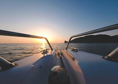 Boat at Sea During Sunset