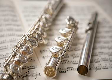 Silver Flute on Sheet Music
