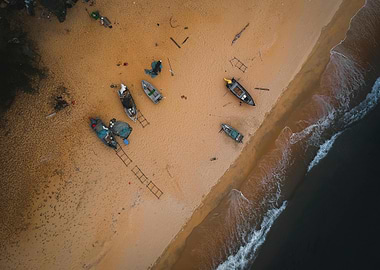 Aerial view of boats on sandy beach