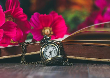 Vintage Pocket Watch on Open Book