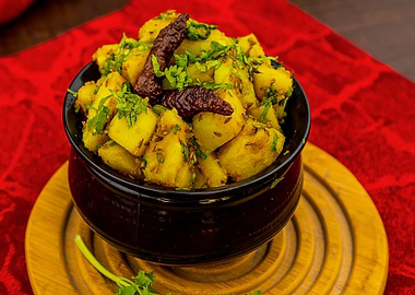 Spicy Potato Dish in Black Bowl