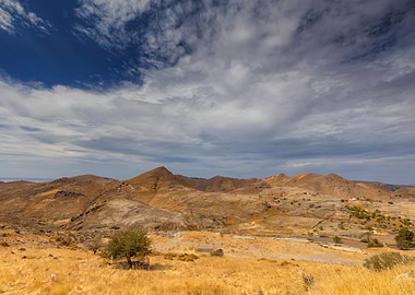 Dry Mountain Landscape with Cloudy Sky, Greek Island