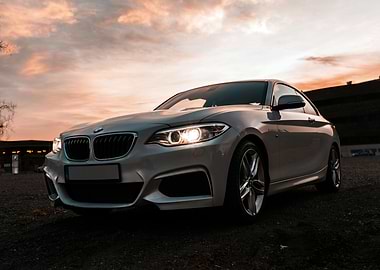 Silver BMW Coupe at Sunset