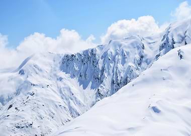 Snowy Mountain Peaks Under Blue Sky